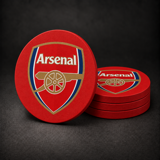 Arsenal FC Drink Coasters with red sides, three stacked and one standing on a dark charcoal background