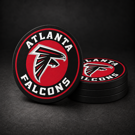 Atlanta Falcons Drink Coasters with black sides, three stacked and one standing on a dark charcoal background
