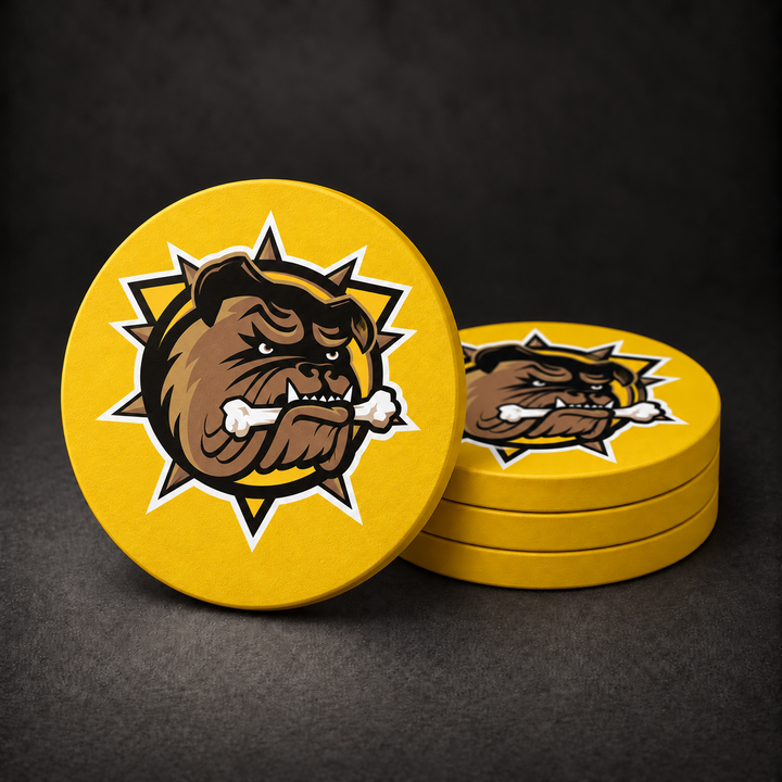 Brantford Bulldogs Drink Coasters with supplied team logo and yellow sides, three stacked and one standing on a dark charcoal background