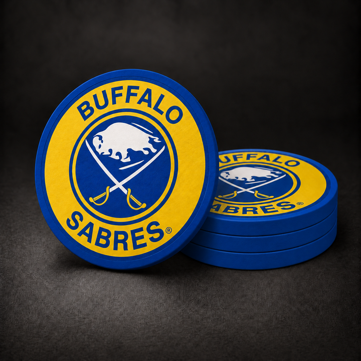 Buffalo Sabres Drink Coasters with blue sides, three stacked and one standing on a dark charcoal background