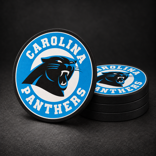 Carolina Panthers Drink Coasters with black sides, three stacked and one standing on a dark charcoal background