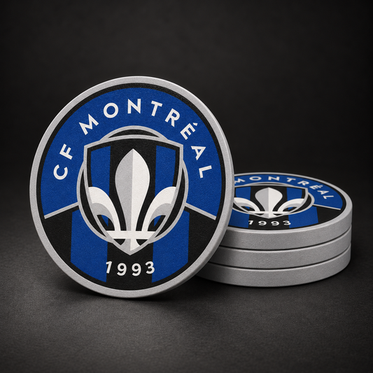 CF Montréal Drink Coasters with light grey sides, three stacked and one standing on a dark charcoal background