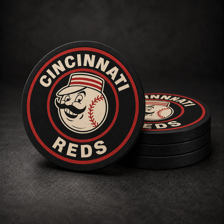 Cincinnati Reds Drink Coasters with black sides, three stacked and one standing on a dark charcoal background