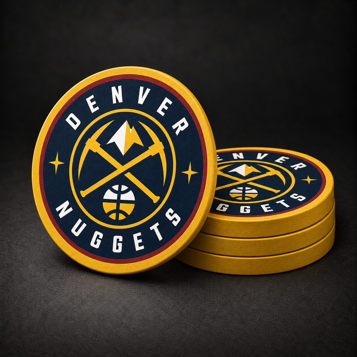 Denver Nuggets Drink Coasters with gold sides, three stacked and one standing on a dark charcoal background