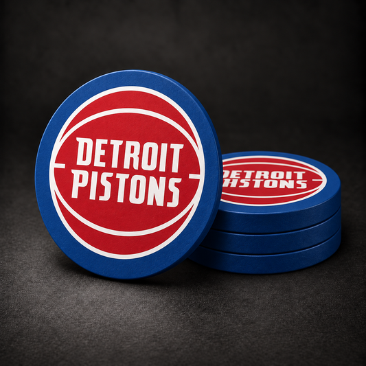 Detroit Pistons Drink Coasters with blue sides, three stacked and one standing on a dark charcoal background