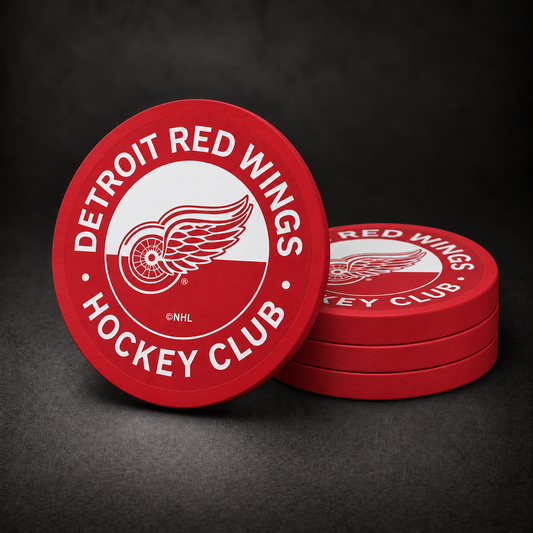 Detroit Red Wings Drink Coasters with red sides, three stacked and one standing on a dark charcoal background
