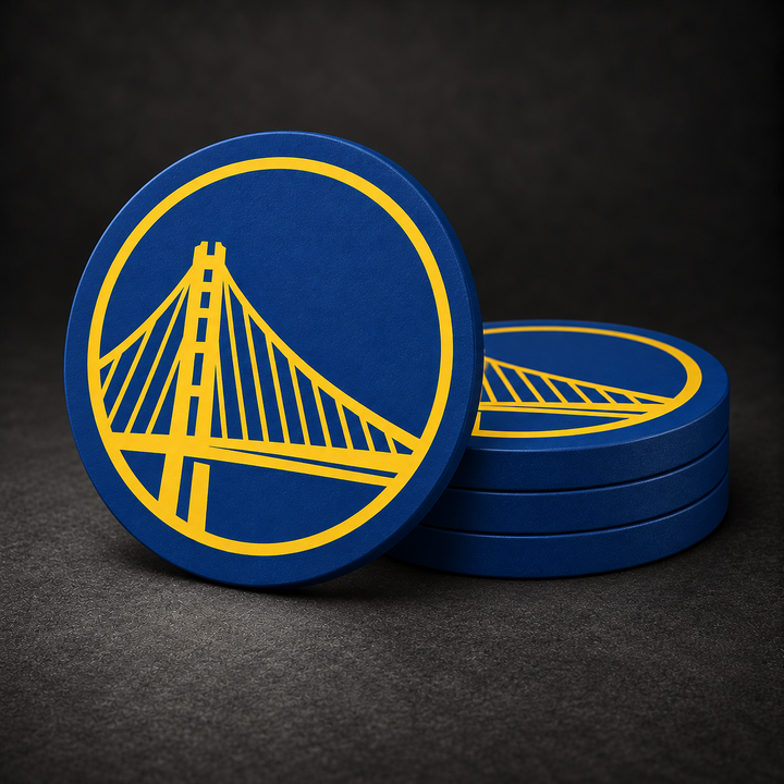 Golden State Warriors Drink Coasters with blue sides, three stacked and one standing on a dark charcoal background