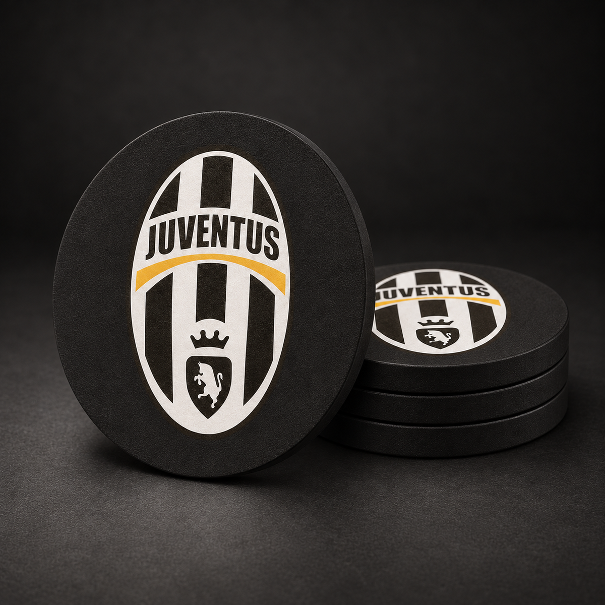 Juventus FC Drink Coasters with black sides, three stacked and one standing on a dark charcoal background