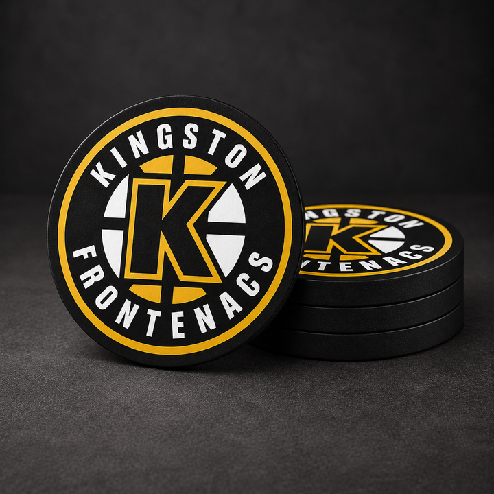 Kingston Frontenacs Drink Coasters with black sides, three stacked and one standing on a dark charcoal background