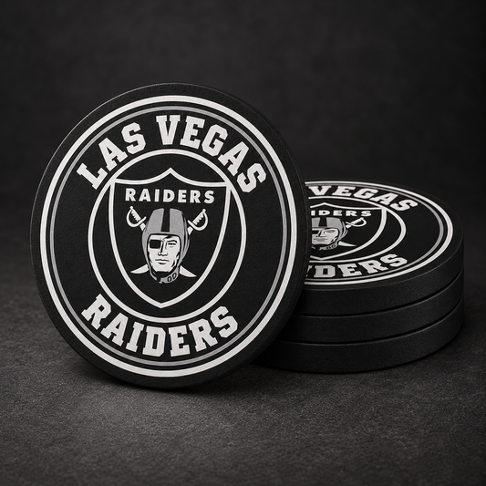 Las Vegas Raiders Drink Coasters with black sides, three stacked and one standing on a dark charcoal background