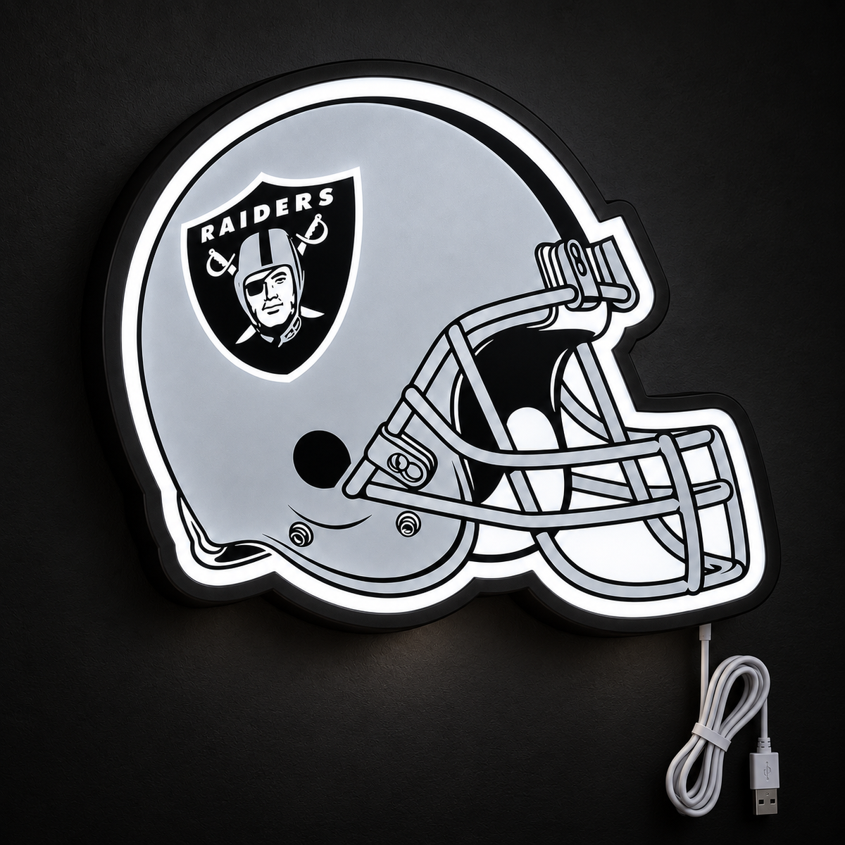 Las Vegas Raiders Helmet LED Sign illuminated at night