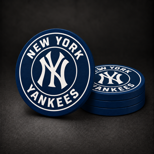 New York Yankees Drink Coasters with navy blue sides, three stacked and one standing on a dark charcoal background