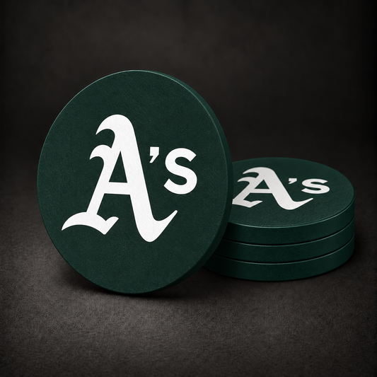 Oakland Athletics Drink Coasters with dark green sides, three stacked and one standing on a dark charcoal background