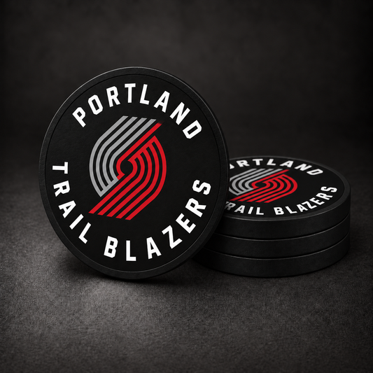 Portland Trail Blazers Drink Coasters with black sides, three stacked and one standing on a dark charcoal background
