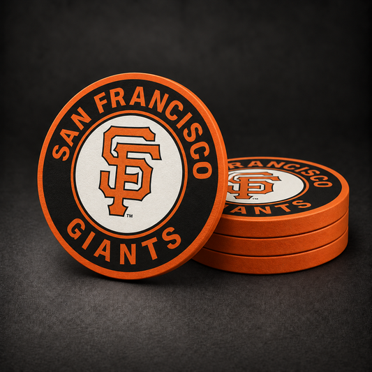 San Francisco Giants Drink Coasters with orange sides, three stacked and one standing on a dark charcoal background