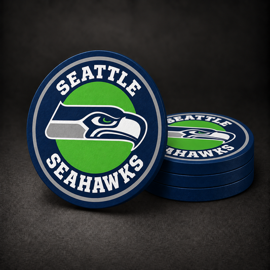 Seattle Seahawks Drink Coasters with navy blue sides, three stacked and one standing on a dark charcoal background