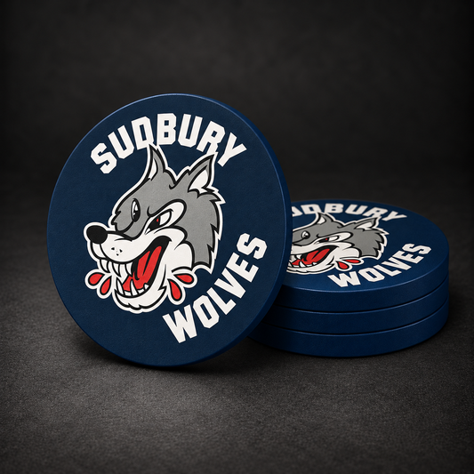Sudbury Wolves Drink Coasters with navy blue sides, three stacked and one standing on a dark charcoal background