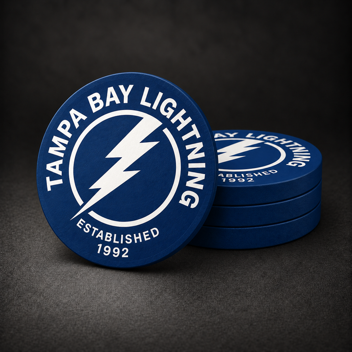 Tampa Bay Lightning Drink Coasters with navy blue sides, three stacked and one standing on a dark charcoal background