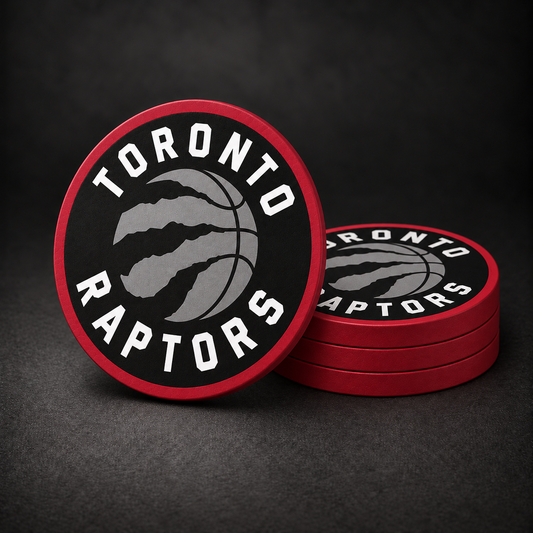 Toronto Raptors Drink Coasters with red sides, three stacked and one standing on a dark charcoal background