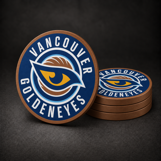 Vancouver Goldeneyes Drink Coasters with copper sides, three stacked and one standing on a dark charcoal background