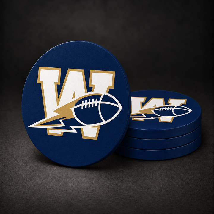 Winnipeg Blue Bombers Drink Coasters with navy blue sides, three stacked and one standing on a dark charcoal background